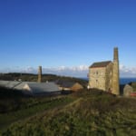 Old Cornish mine house conversion in wheel kitty landscape with sea